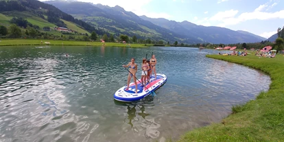 Ausflug mit Kindern - Niederhof (Bruck an der Großglocknerstraße) - Stand Up Paddle Vermietung. Standard für 1 Person oder einen riesen SUP für bis zu 10 Personen. - Gasteiner Badesee