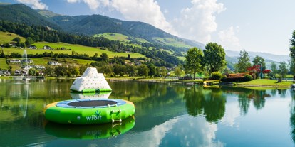 Ausflug mit Kindern - Umgebungsschwerpunkt: See - Österreich - Erlebnisbadesee Uttendorf/Weißsee mit Trampolin, Eisberg und Rutsche - Erlebnisbadesee Uttendorf