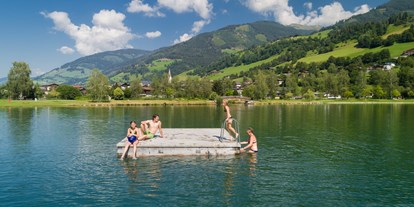 Ausflug mit Kindern - Umgebungsschwerpunkt: See - Österreich - Badeinsel beim Erlebnisbadese Uttendorf/Weißsee - Erlebnisbadesee Uttendorf