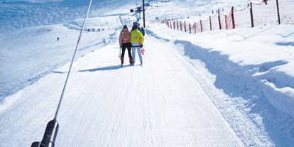 Ausflug mit Kindern - Tartar - Symbolbild für Ausflugsziel Skilift Mutten (Graubünden). - Skilift Mutten