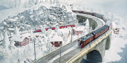 Ausflug mit Kindern - Ausflugsziel ist: eine Bahn - Hamburg - Die nördlichsten Gefilde des Wunderlands sind trotz angenehmer 19°C im Skandinavien-Abschnitt mit dichtem Schnee bedeckt. Nahe der Mine Kiruna beginnt das 50 m² große Permafrostgebiet im Miniatur Wunderland. - Miniatur Wunderland