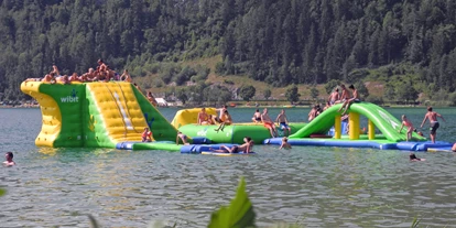 Trip with children - Witterung: Bewölkt - Tyrol - Badeplatz Seepromenade & Badestrand Ostufer mit Aqua Funpark