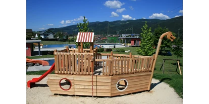 Trip with children - Restaurant - Austria - Unser Spielplatz mit dem neuen Piratenschiff - ideal für unsere kleinen Gäste - Freibad Mitterdorf