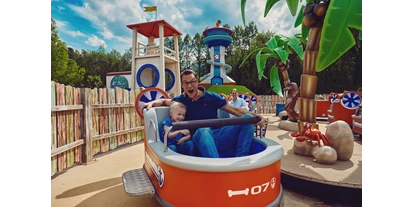 Ausflug mit Kindern - Wickeltisch -  PAW Patrol-Attraktion "Zuma's Zoomers":
© 2021 Spin Master. Alle Rechte vorbehalten. - Movie Park Germany