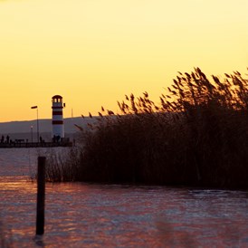Urlaub: Leuchtturm, Podersdorf am See, während dem Sonnenuntergang - Neusiedler See